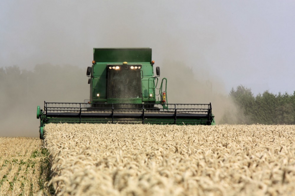 Combine harvester operating in a wheat field